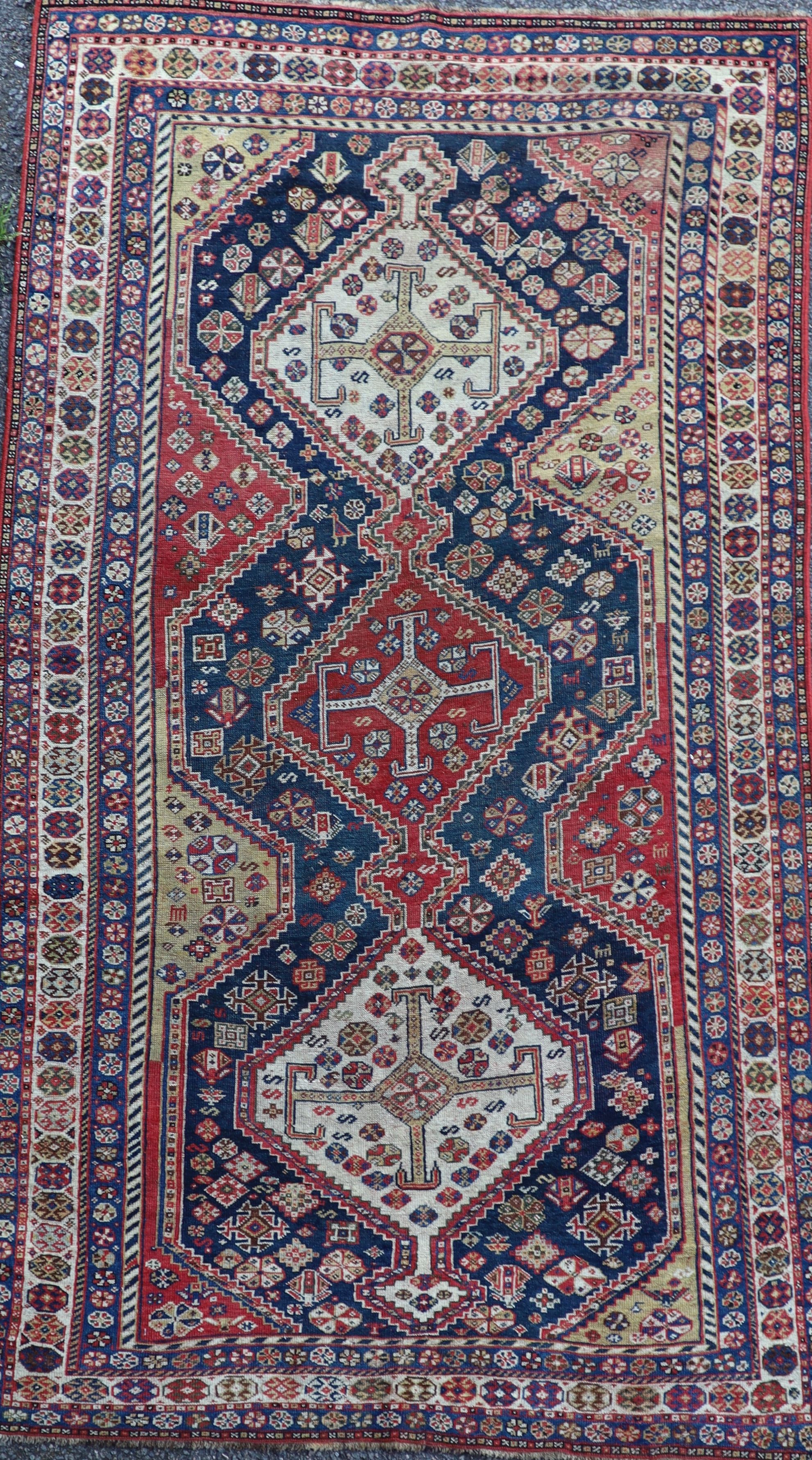 An antique Qashqai blue ground rug 220 x 127cm
